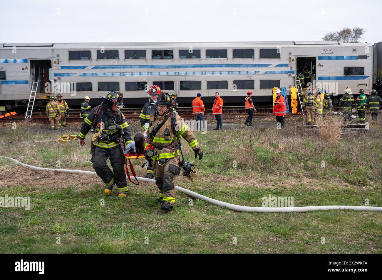 Pretend Casualties Are Removed From A LIRR Long Island Rail Road fake-smoke-billows-from-a-lirr-long-island-rail-road-train-during-a