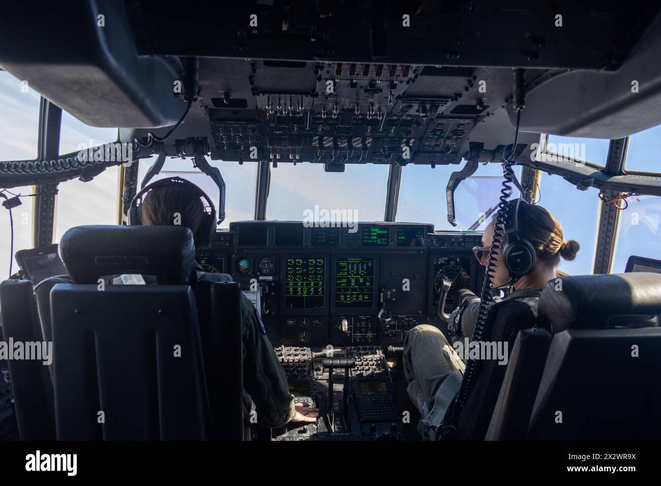 U.S. Marine Corps Capt. Olivia Bair, left, and Capt. Morgan Jones, both KC-130J Super Hercules pilots with Marine Aerial Refueler Transport Squadron (VMGR) 352, Marine Aircraft Group 11, 3rd Marine Aircraft Wing, fly a KC-130J Super Hercules over Petco Park, San Diego, during a San Diego Padres home game, April 21, 2024. VMGR-352 supported the Padres’ Sunday Salute to Women in the Military to honor the commitment of U.S. military service members and connect with the San Diego community. (U.S. Marine Corps photo by Lance Cpl. Nicholas Johnson) Stock Photo