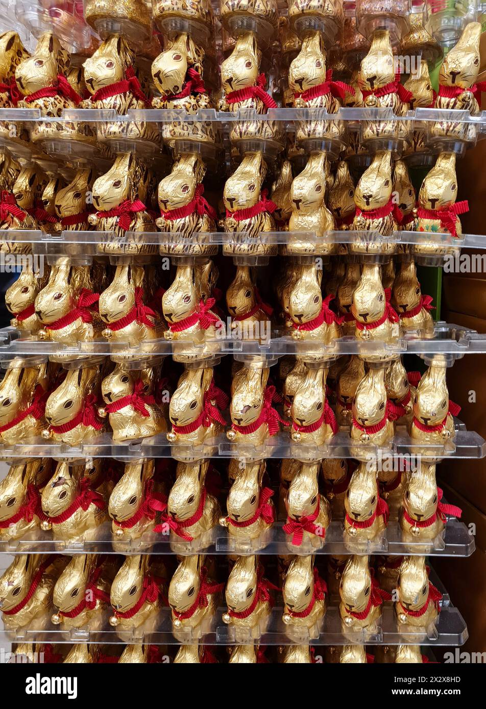 26.03.2024, Bremen, Bremen, Germany - Chocolate Easter bunnies, gold bunnies of the Lindt brand in a supermarket. 00A240326D001CAROEX.JPG [MODEL RELEA Stock Photo