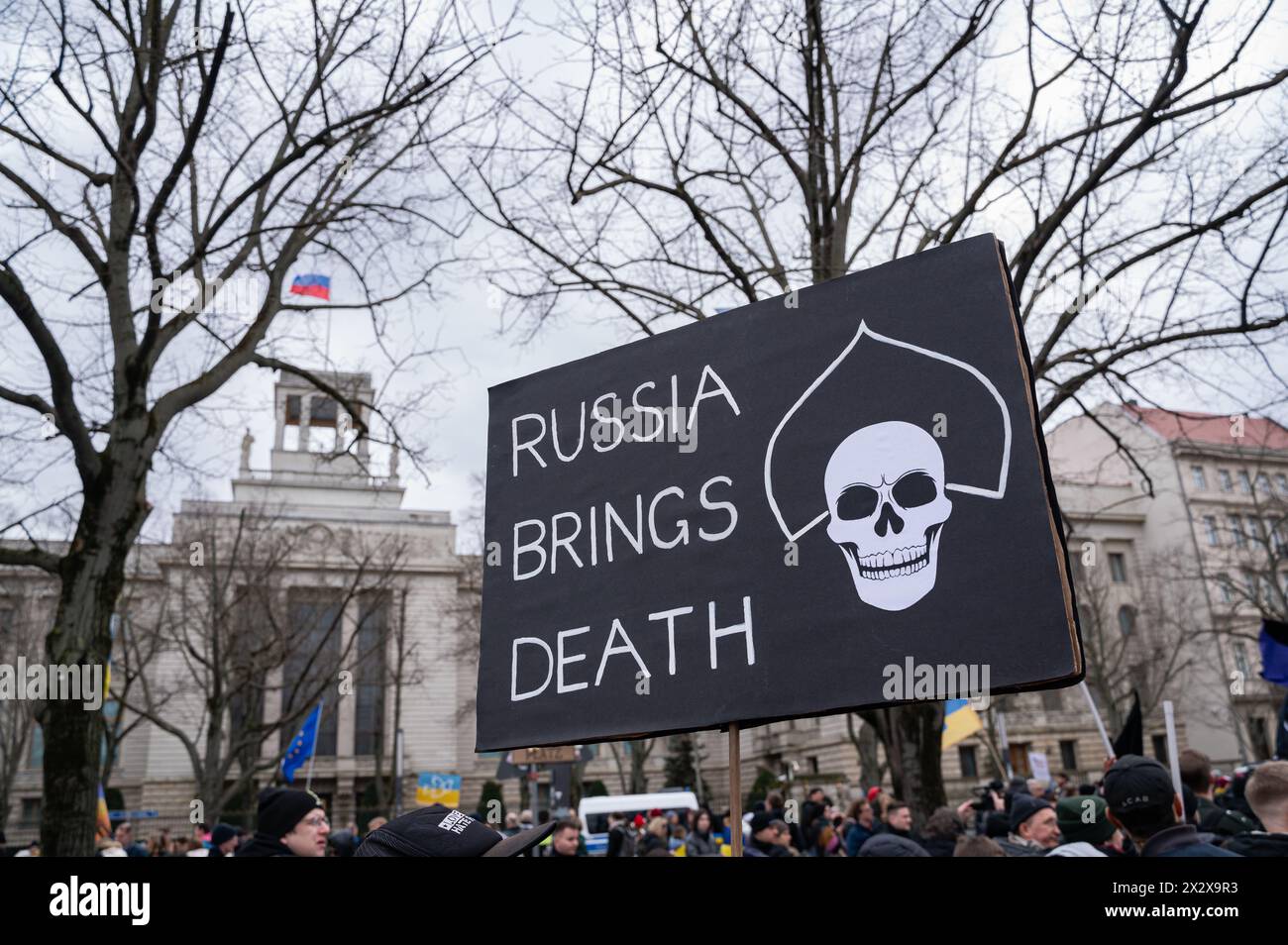 24.02.2024, Berlin, , Germany - Europe - A participant holds a placard with the words Russia Brings Death during a demonstration in front of the Russi Stock Photo