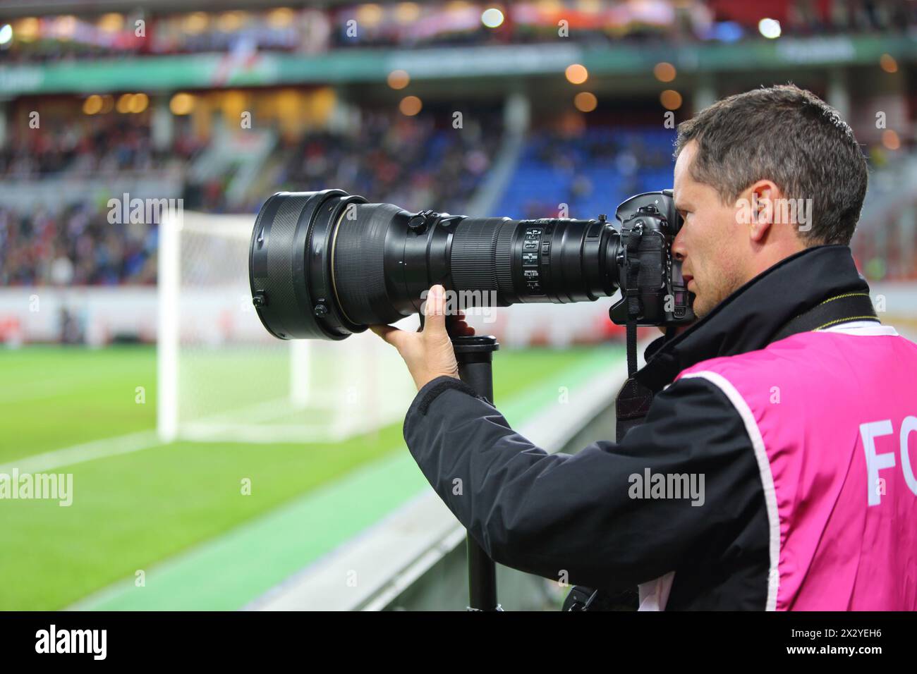 MOSCOW - SEP 7: Photographer shoot the game Russian team against Northern Ireland on Lokomotiv Stadium in Cherkizovo on September 7, 2012 in Moscow, R Stock Photo