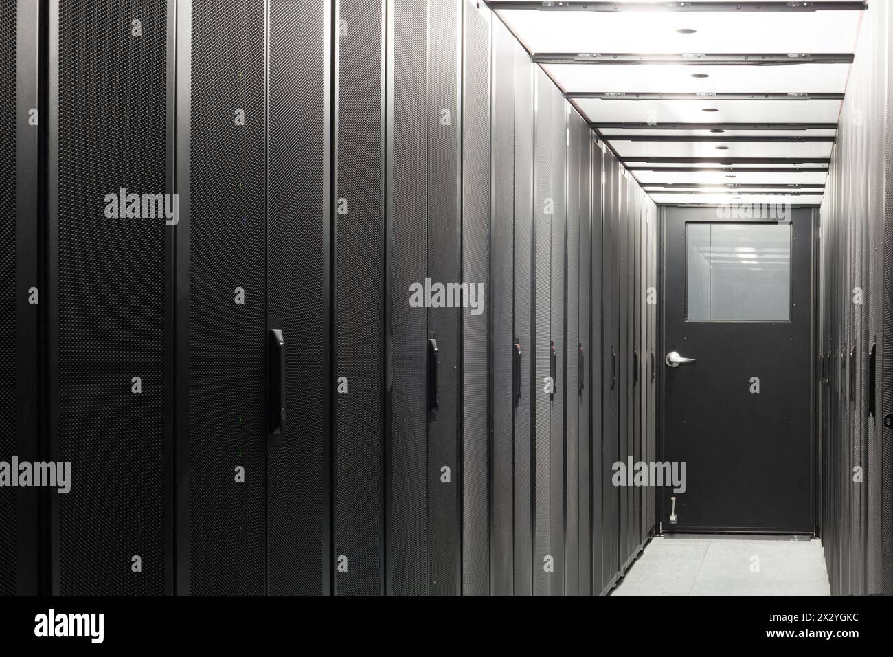 Telecom equipment in racks in a sealed corridor. Stock Photo
