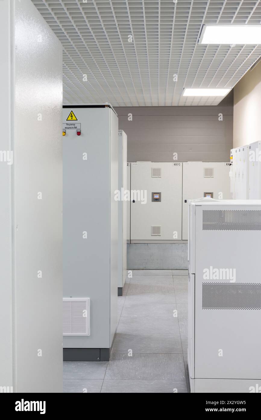 Light room with rows of racks with equipment for telecom Stock Photo ...