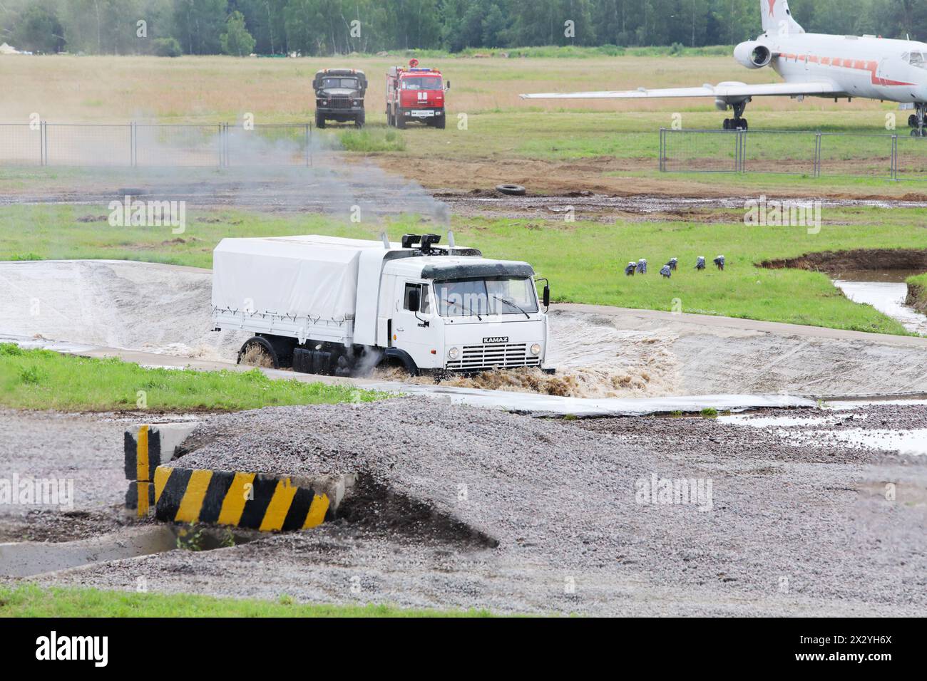 ZHUKOVSKY - JUNE 25: White military KAMAZ truck overcome water obstacles pit at demonstrations of technique at second International Forum Engineering Stock Photo