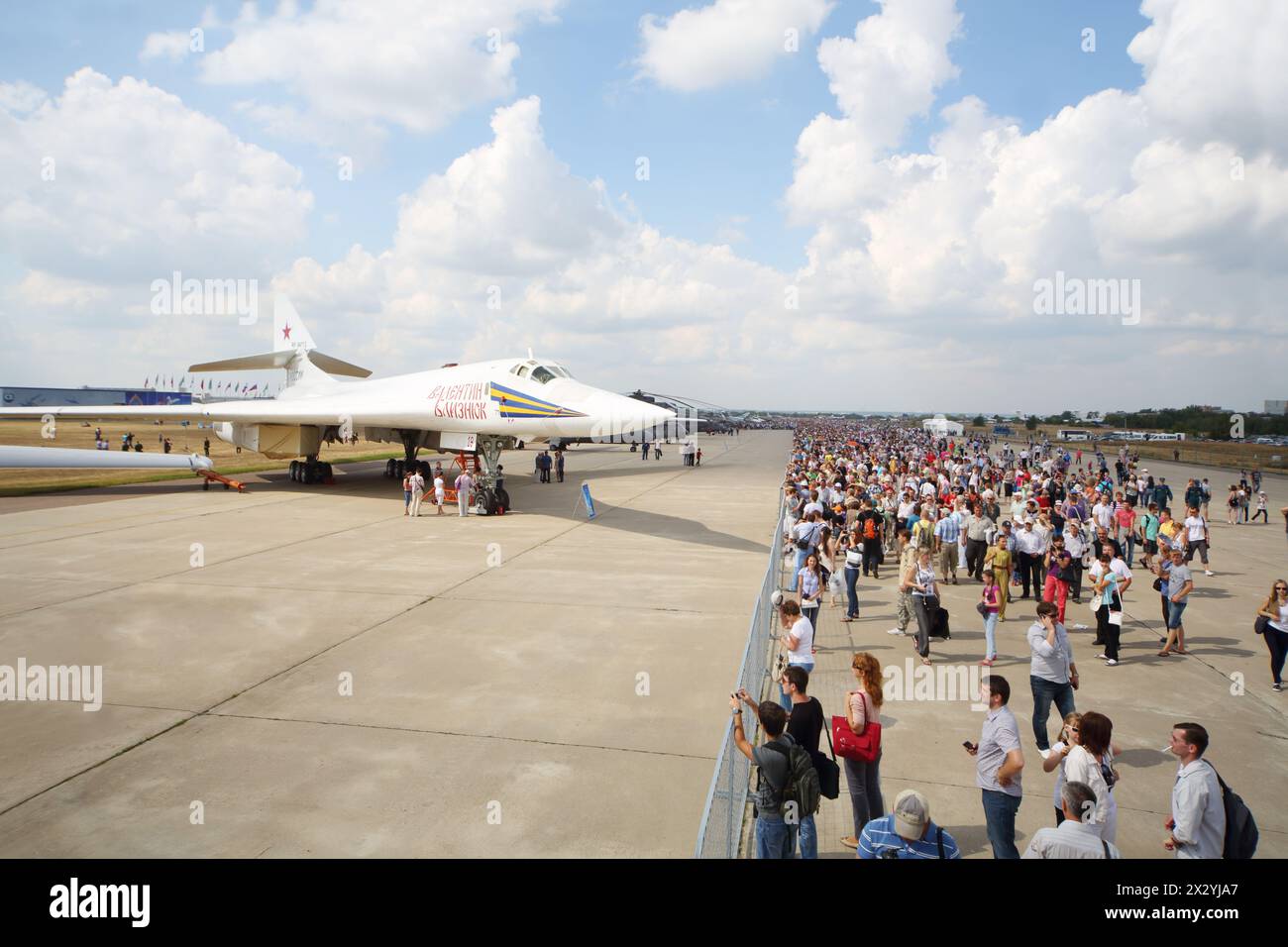 ZHUKOVSKY - AUGUST 12: Airplane Valentine Blyznyuk and spectators on airshow devoted to 100 anniversary of Russian Air Forces on August 12, 2012 in Zh Stock Photo