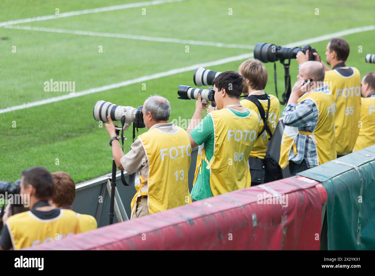 MOSCOW - AUG 15:  Photographers shoot the game between Russia national team and Ivory Coast at Lokomotiv Stadium on August 15, 2012 in Moscow, Russia. Stock Photo