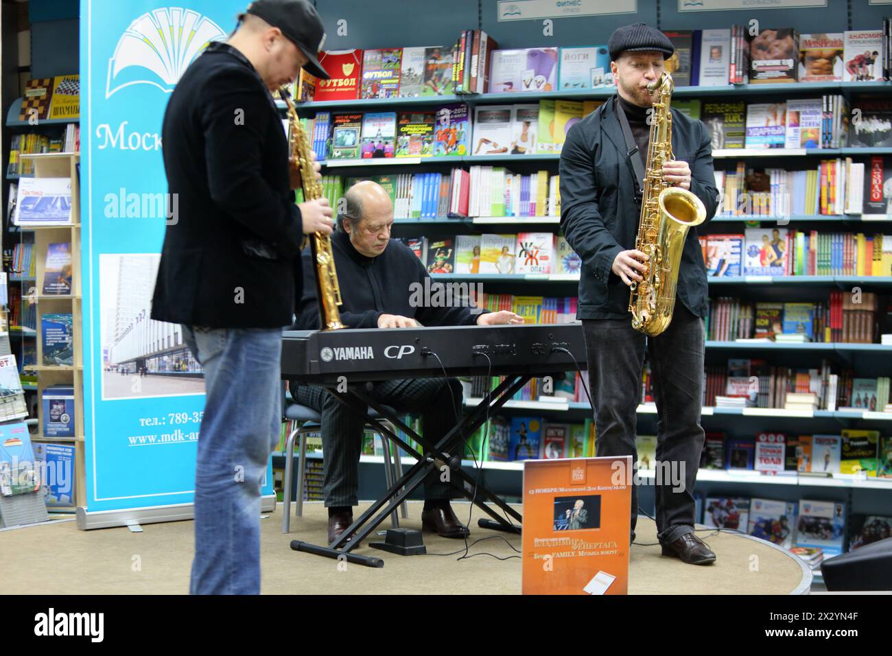 MOSCOW - NOVEMBER 13: Igor Bril and his sons Alexander and Dmitry saxophonists play music at presentation of book Brill FAMILY. Music around by Vladim Stock Photo