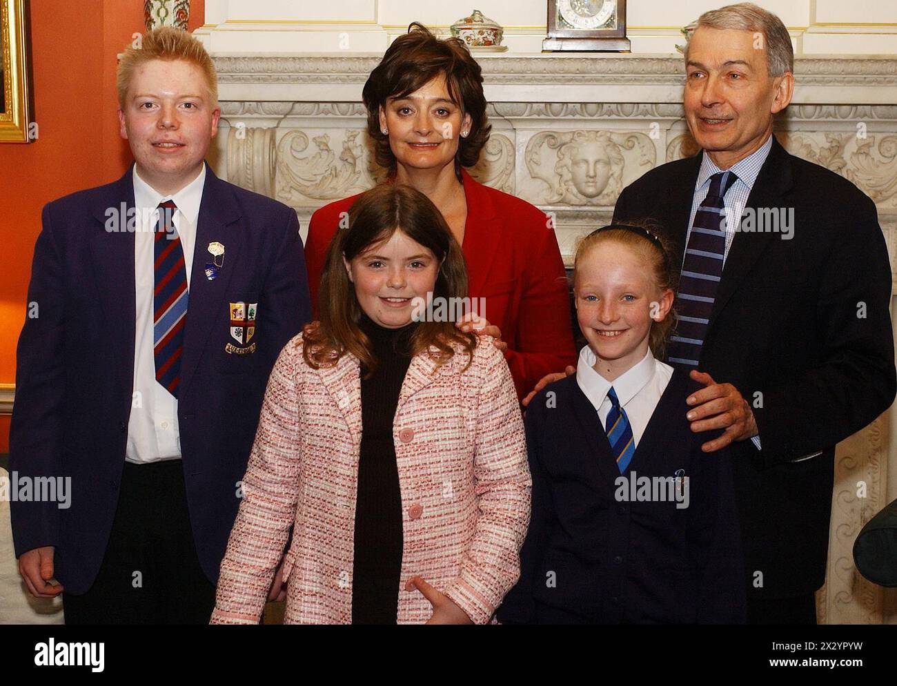 File photo dated 21/04/04 of Cherie Blair with (left to right) Alastair Beddow, Emily Mullins Natalie Reynolds, and Frank Field MP, all from Birkenhead, Merseyside, at 10 Downing Street, in central London. The Prime Minister's wife was holding a regular tea party to which school children are invited with their local MP's. Former Labour minister and crossbench peer Frank Field has died aged 81, his family has announced. Issue date: Wednesday April 24, 2024. Stock Photo