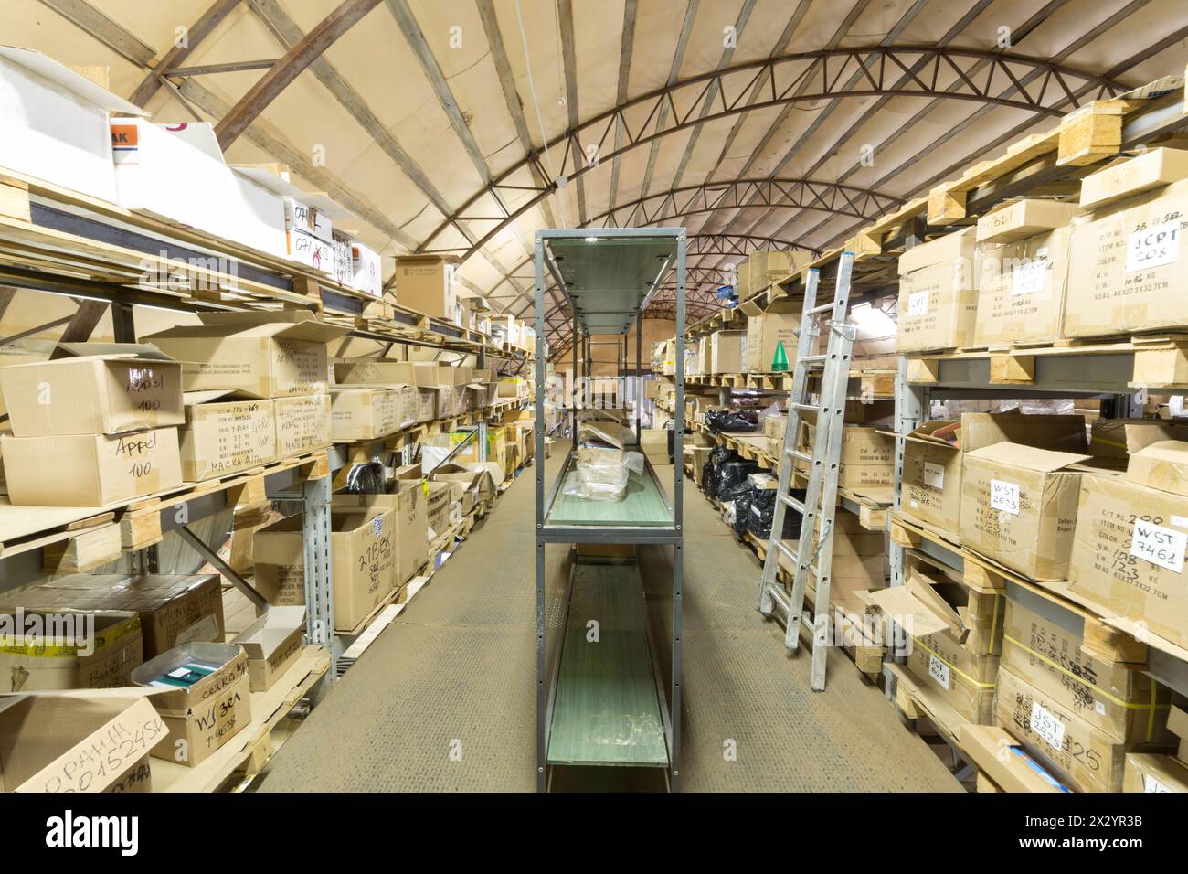 Large warehouse of sport equipment with lots of cardboard boxes Stock Photo