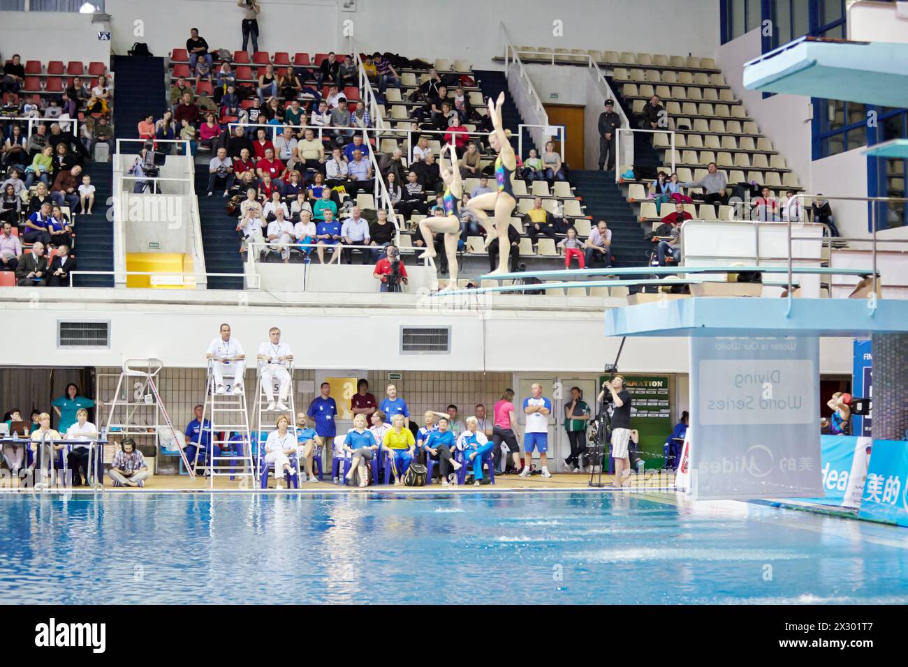 MOSCOW - APR 13:  Competitions on  syncronized springboard diving in Pool of SC Olympic on day of third phase of the World Series of FINA Diving, Apri Stock Photo