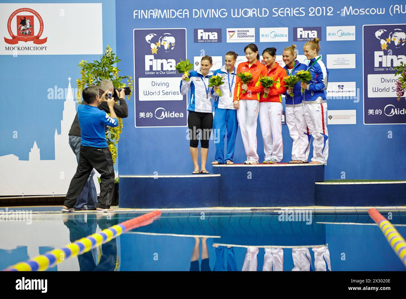 MOSCOW - APR 13:  Female athletes-medalists are pfotographed on victory podium at Pool of SC Olympic on day of third phase of the World Series of FINA Stock Photo