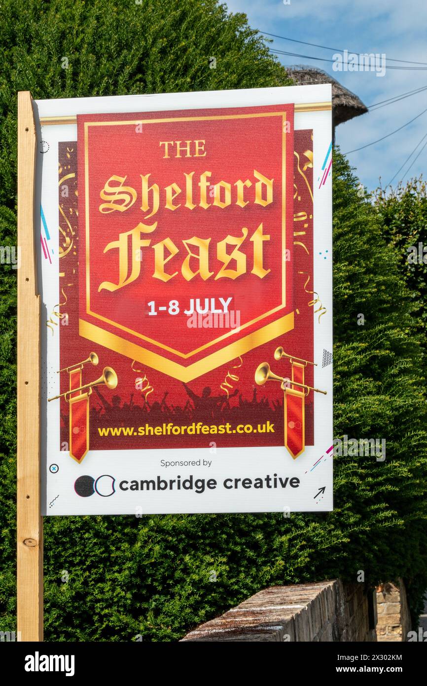 Poster of 'The Shelford Feast' village festival, displayed outdoors on a sunny day. Great Shelford, Cambridgeshire, England, UK Stock Photo