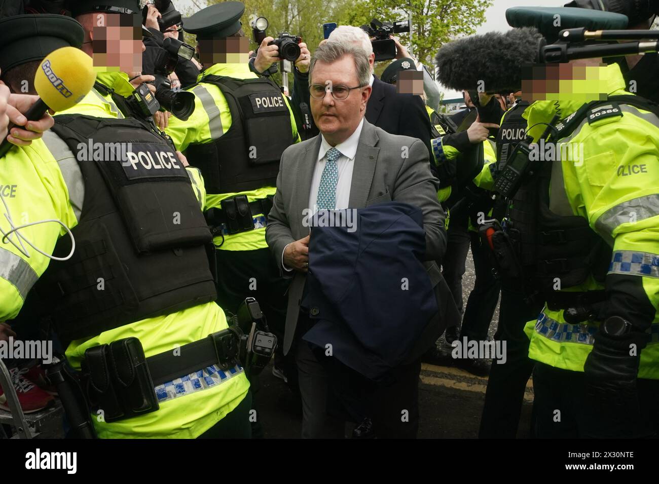 EDITORS NOTE IMAGE PIXELLATED BY THE PA PICTURE DESK FOR THE PROTECTION OF OFFICERS OF THE PSNI Former DUP leader Sir Jeffrey Donaldson with his solicitor John McBurney arrives at Newry Magistrates' Court, where he is charged with several historical sexual offences. Sir Jeffrey resigned as DUP leader and was suspended from the party following the charges. Picture date: Wednesday April 24, 2024. Stock Photo