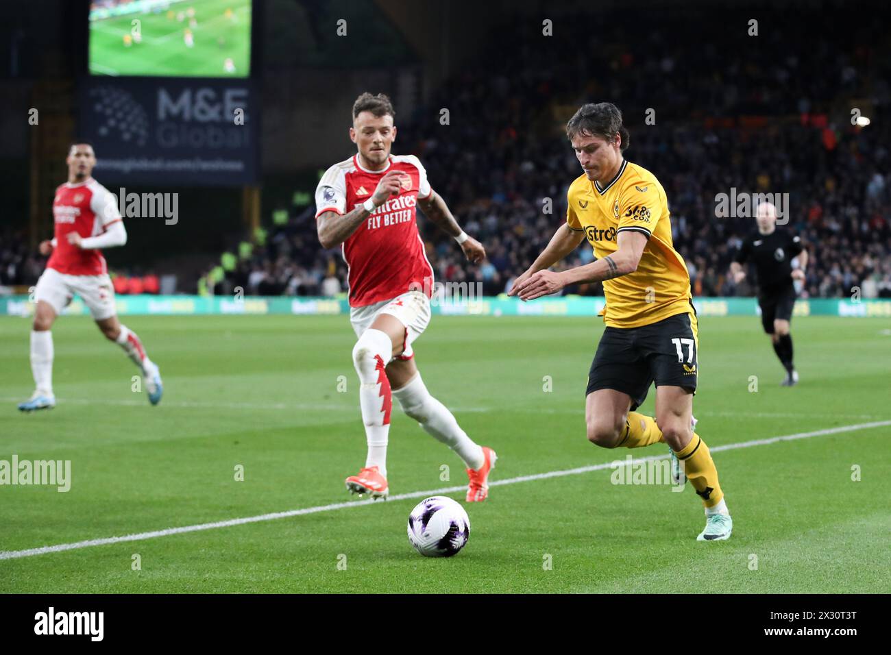 WOLVERHAMPTON, ENGLAND - APRIL 20: Hugo Bueno of Wolverhampton Wanderers and Ben White of Arsenal during the Premier League match between Wolverhampton Wanderers and Arsenal FC at Molineux on April 20, 2024 in Wolverhampton, England.(Photo by MB Media/MB Media) Stock Photo