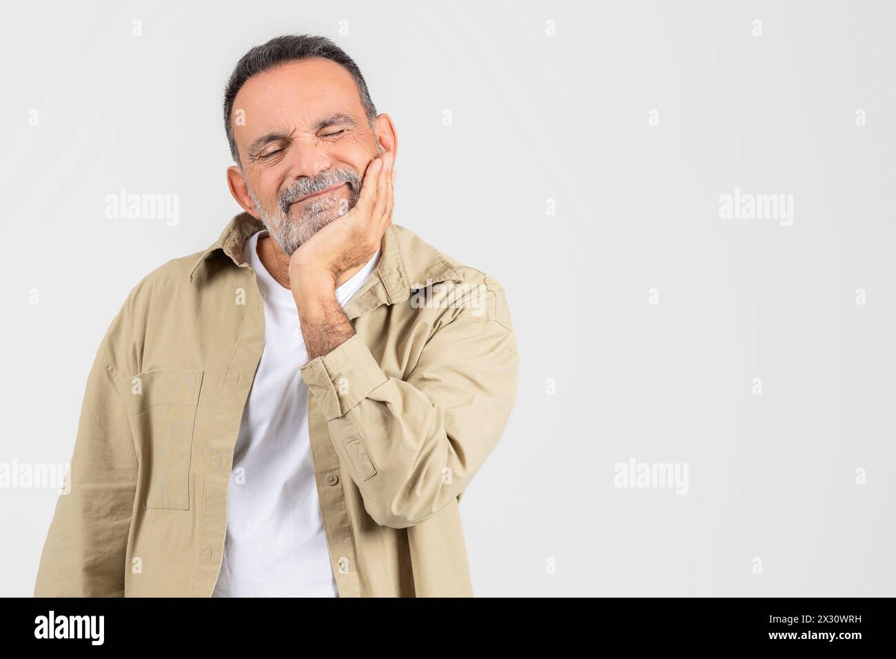 Man With Hand on Face, Suffer From Toothache Stock Photo