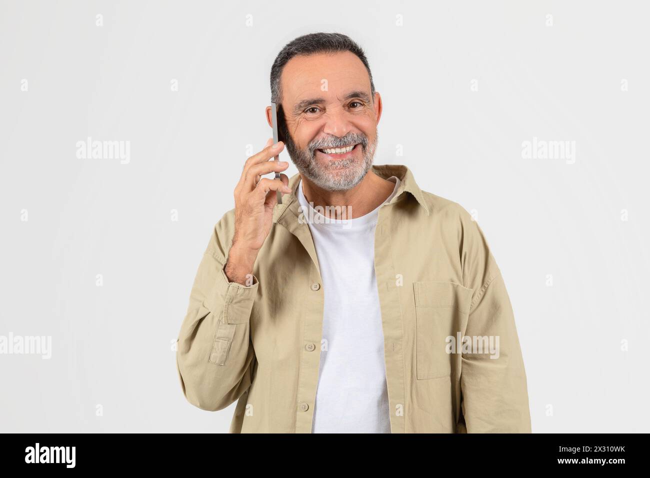 Man Talking on Cell Phone On White Stock Photo