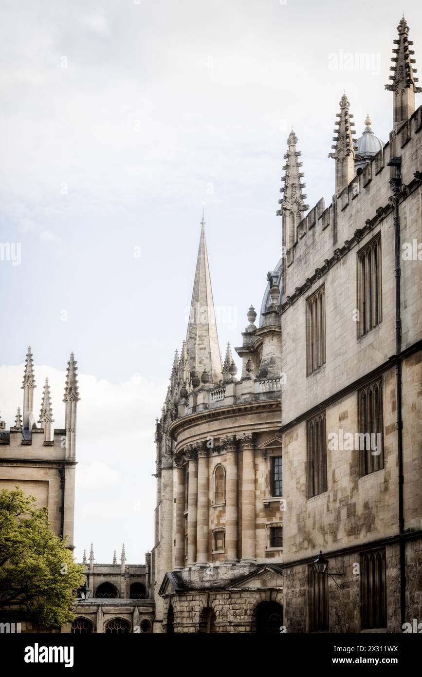 Oxford University college buildings looking into Radcliffe Square with St Mary's Church in the background in Oxford Stock Photo