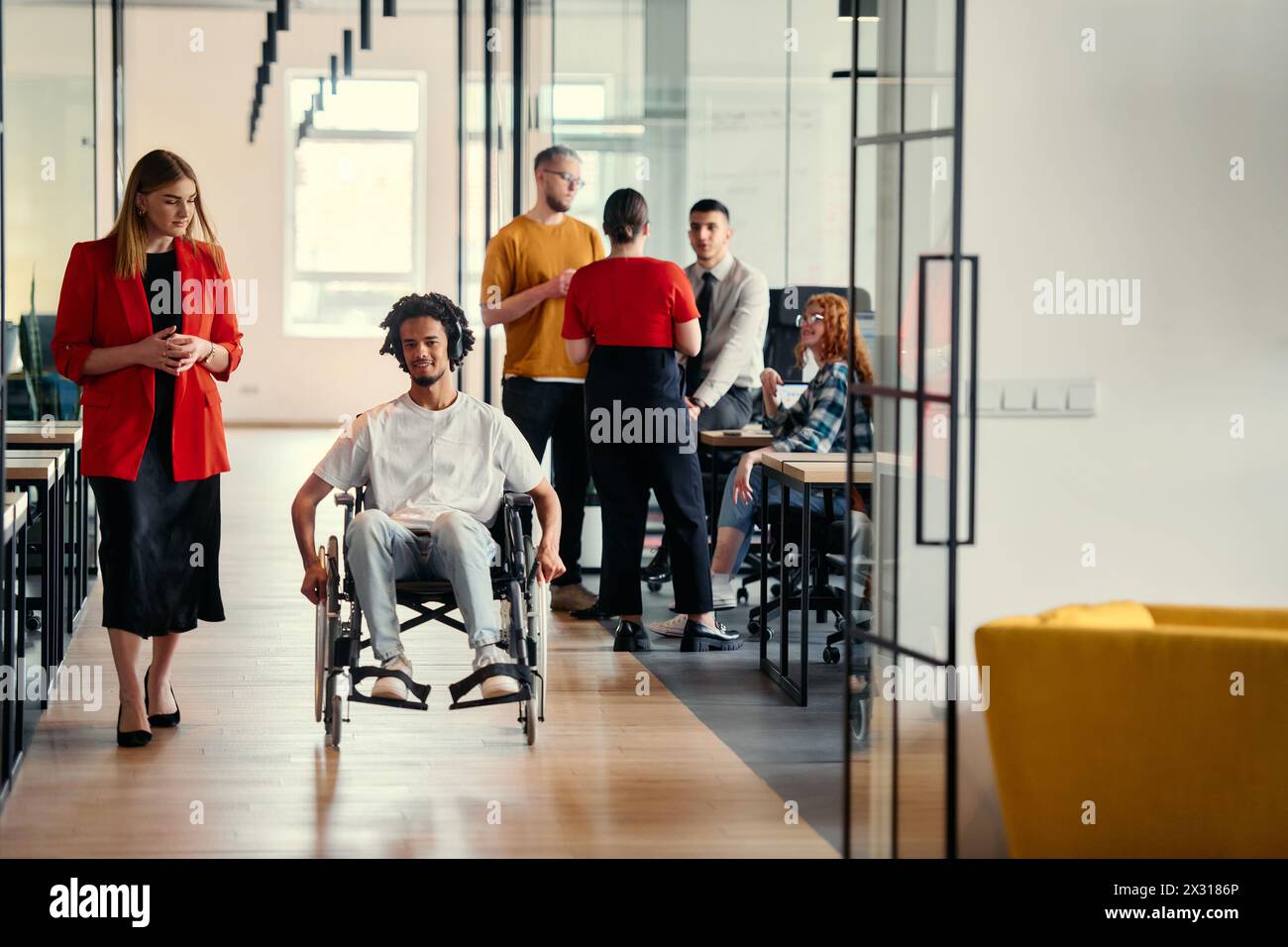 A diverse group of young professionals, including businesswomen and an ...