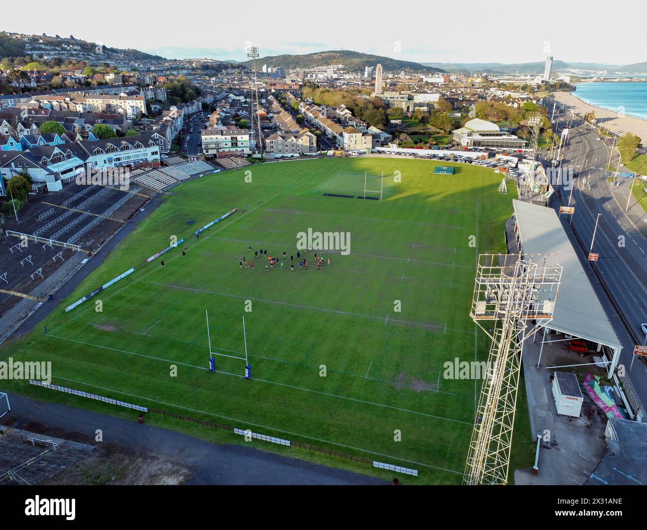 Editorial Swansea, UK - April 23, 2024: An aerial view of St Helen's Rugby and Cricket Ground, The Patti Pavilion, Victoria Park, Guild Hall and Mumbl Stock Photo