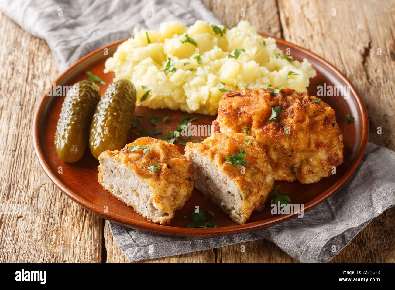 Czech food Dutch Schnitzel Holandsky Rizek served with mashed potatoes closeup on the plate on the table. Horizontal Stock Photo