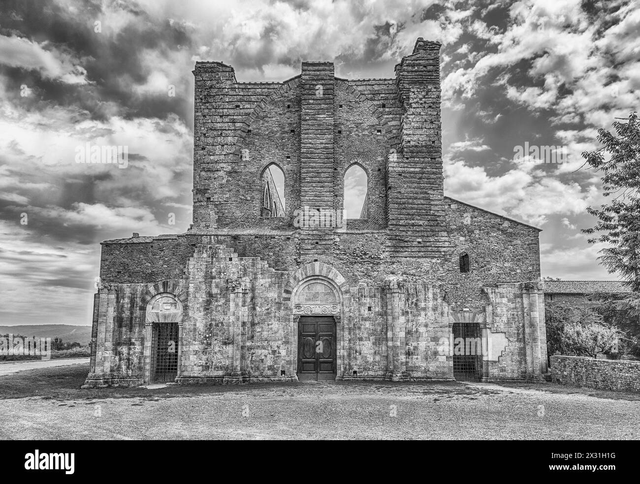 CHIUSDINO, ITALY - JUNE 22: Exterior view of the iconic Abbey of San Galgano, a Cistercian Monastery in the town of Chiusdino, in the province of Sien Stock Photo