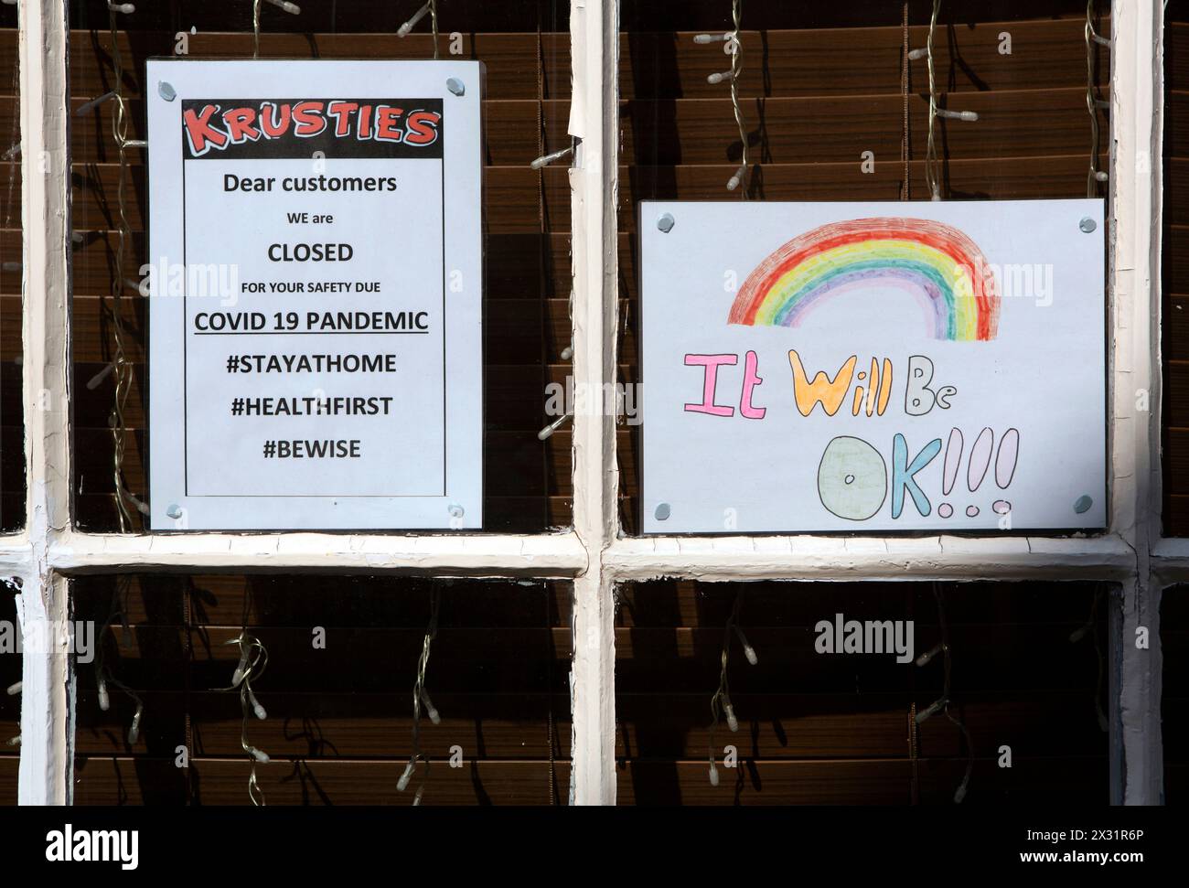 Children’s rainbow messages signs saying “It will be ok” and ...