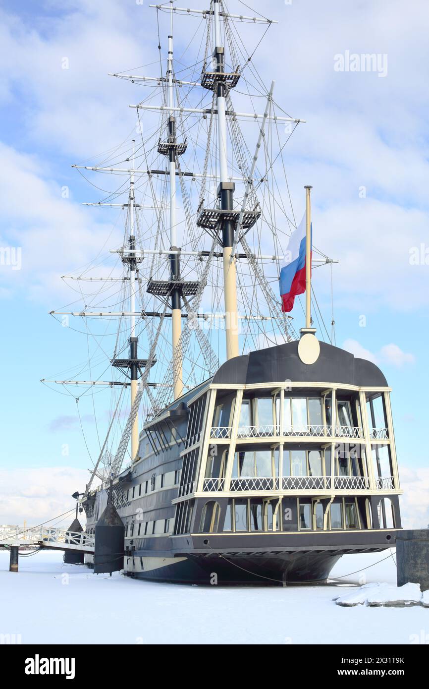 Historical reconstruction of the battleship of the XVIII century with the Russian flag at the pier Stock Photo