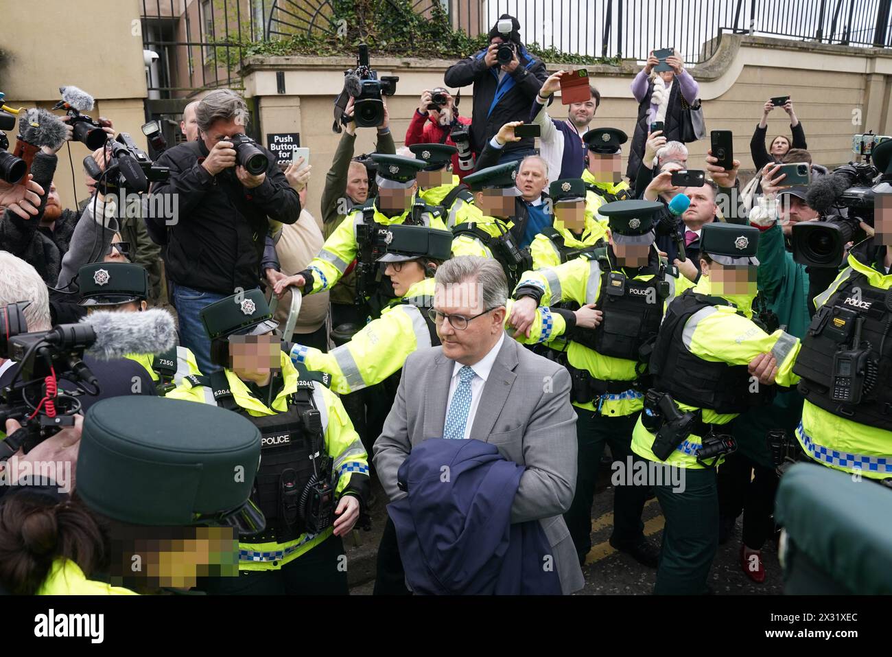 EDITORS NOTE IMAGE PIXELLATED BY THE PA PICTURE DESK FOR THE PROTECTION OF OFFICERS OF THE PSNI Former DUP leader Sir Jeffrey Donaldson leaving Newry Magistrates' Court, after he was released on continuing bail on a number of historical sex charges, including one count of rape. Sir Jeffrey resigned as DUP leader and was suspended from the party following the charges. Picture date: Wednesday April 24, 2024. Stock Photo
