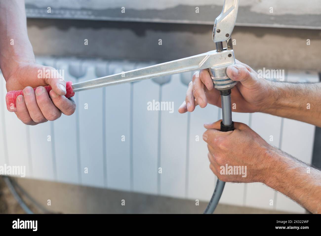 Preparation the pipes for the heating system crimping Stock Photo