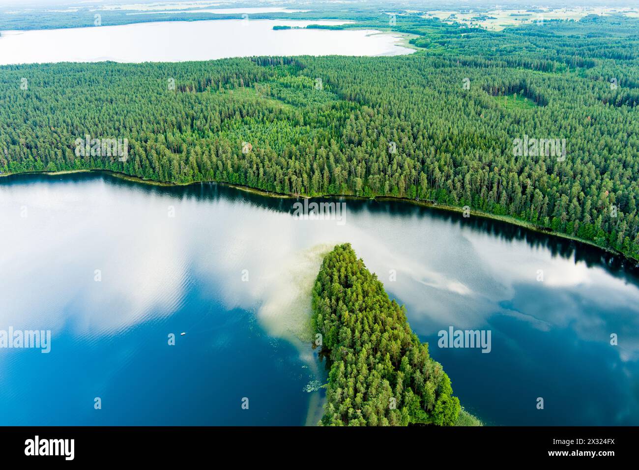 Scenic aerial view of Sciuro Ragas peninsula, separating White Lakajai and Black Lakajai lakes. Picturesque landscape of lakes and forests of Labanora Stock Photo