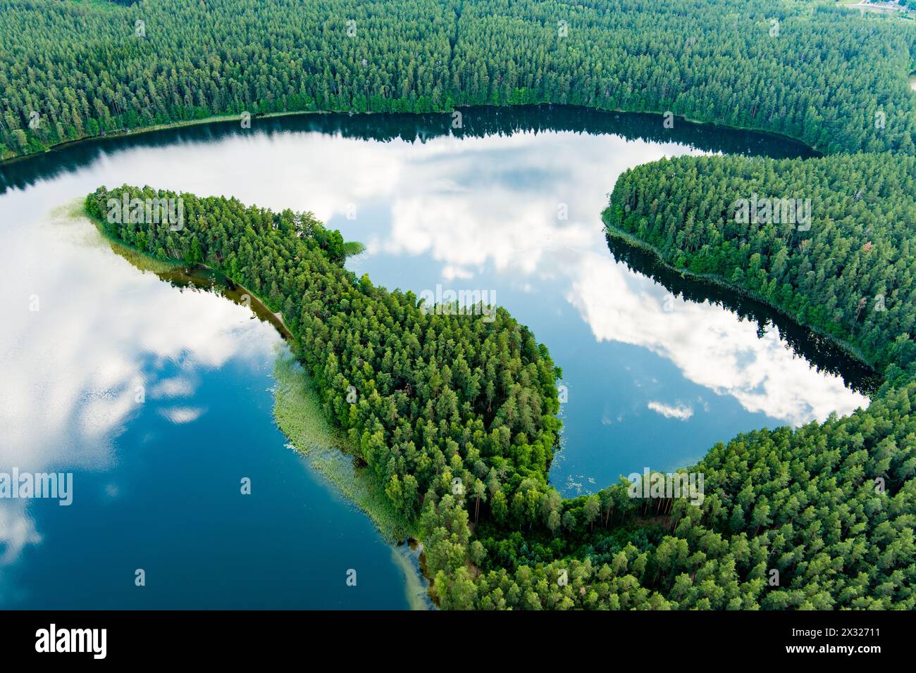 Scenic aerial view of Sciuro Ragas peninsula, separating White Lakajai and Black Lakajai lakes. Picturesque landscape of lakes and forests of Labanora Stock Photo