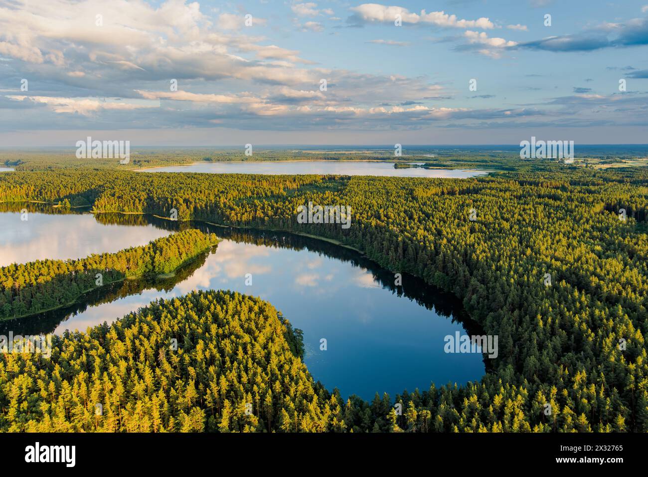 Scenic aerial view of Sciuro Ragas peninsula, separating White Lakajai and Black Lakajai lakes. Picturesque landscape of lakes and forests of Labanora Stock Photo