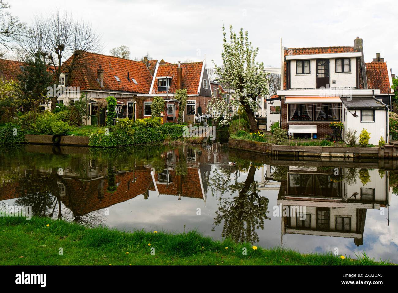 Properties on a canal in Edam town once a shipbuilding town world famous for its cheese. and located in the northern Dutch countryside near Amsterdam Stock Photo