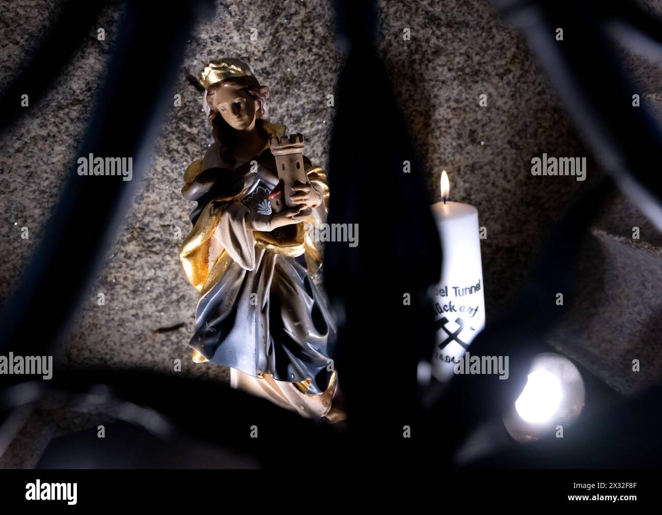Munich, Germany. 24th Apr, 2024. A figure of St. Barbara stands in the rescue shaft 3 near the Hackerbrücke bridge at the symbolic tunnel cut on the construction site. The first tunnel work on the 2nd main line was given the go-ahead with the tunnel cut. Rescue shaft 3 will serve as an escape route in the event of an accident. Credit: Sven Hoppe/dpa/Alamy Live News Stock Photo