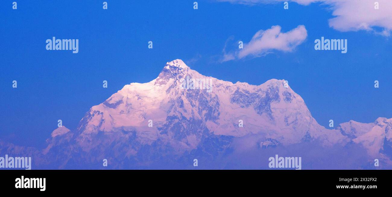 Kanchenjunga range mountain in Himalaya against blue sky Stock Photo