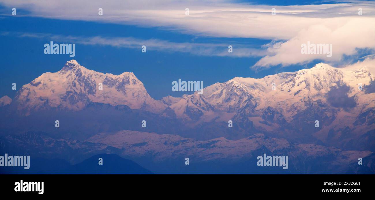 Kanchenjunga range mountain in Himalaya against blue sky Stock Photo