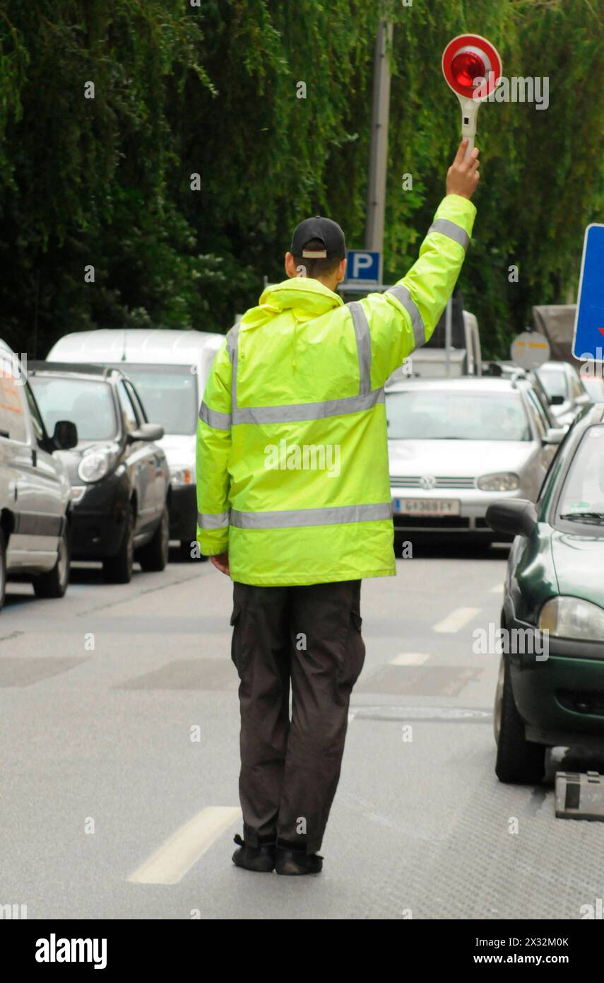 traffic guard or traffic controller for traffic regulation on the street traffic guard or traffic controller Stock Photo