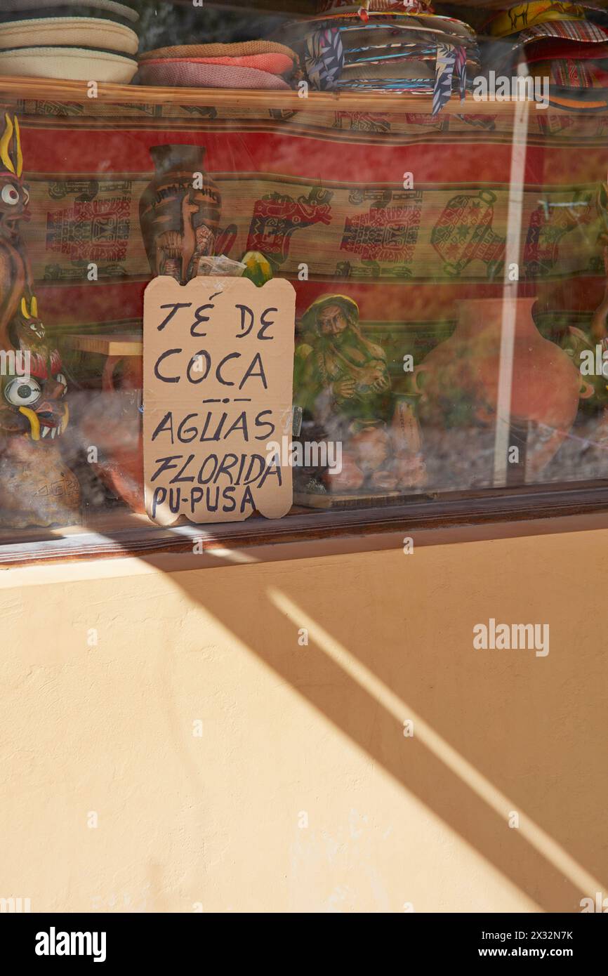 A signboard saying 'Coca Tea' in a shop of Purmamarca, Jujuy, Argentine Northwest. Coca Tea is used to help avoid altitude sickness. Stock Photo