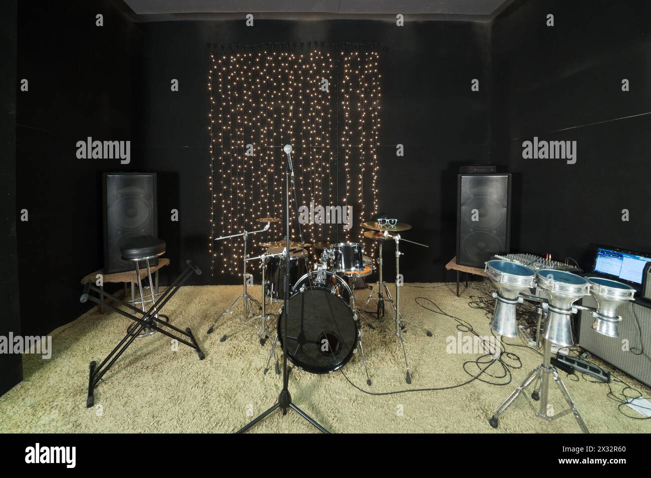 Studio room with drum set, microphones and recording equipment. Stock Photo