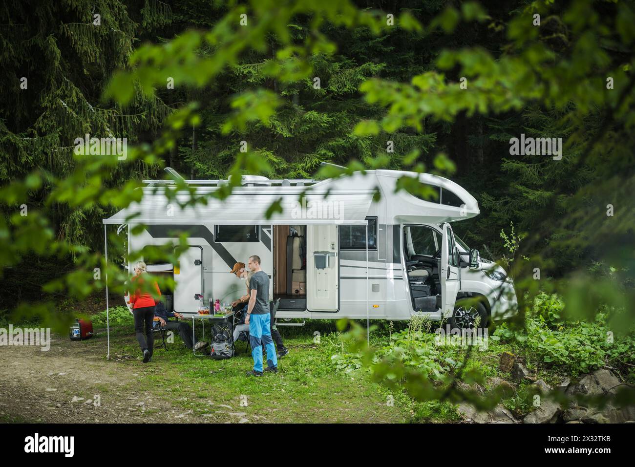 Caucaisna Friends on a Camper Van Road Trip. Dry Camping in the Wilderness. RVing Theme. Stock Photo