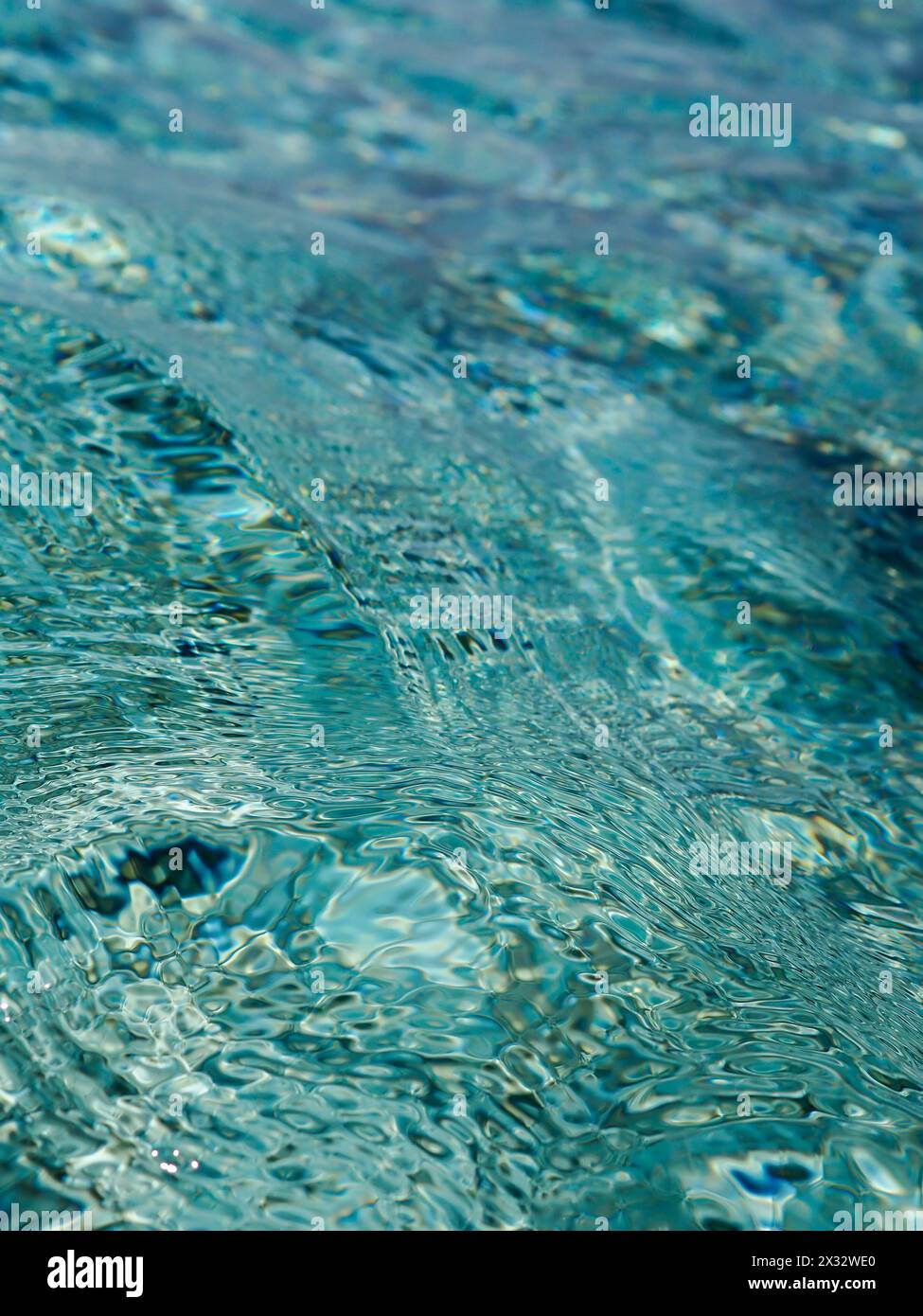 Blue / turquoise sea background of gently swirling water taken in the Maldives Stock Photo