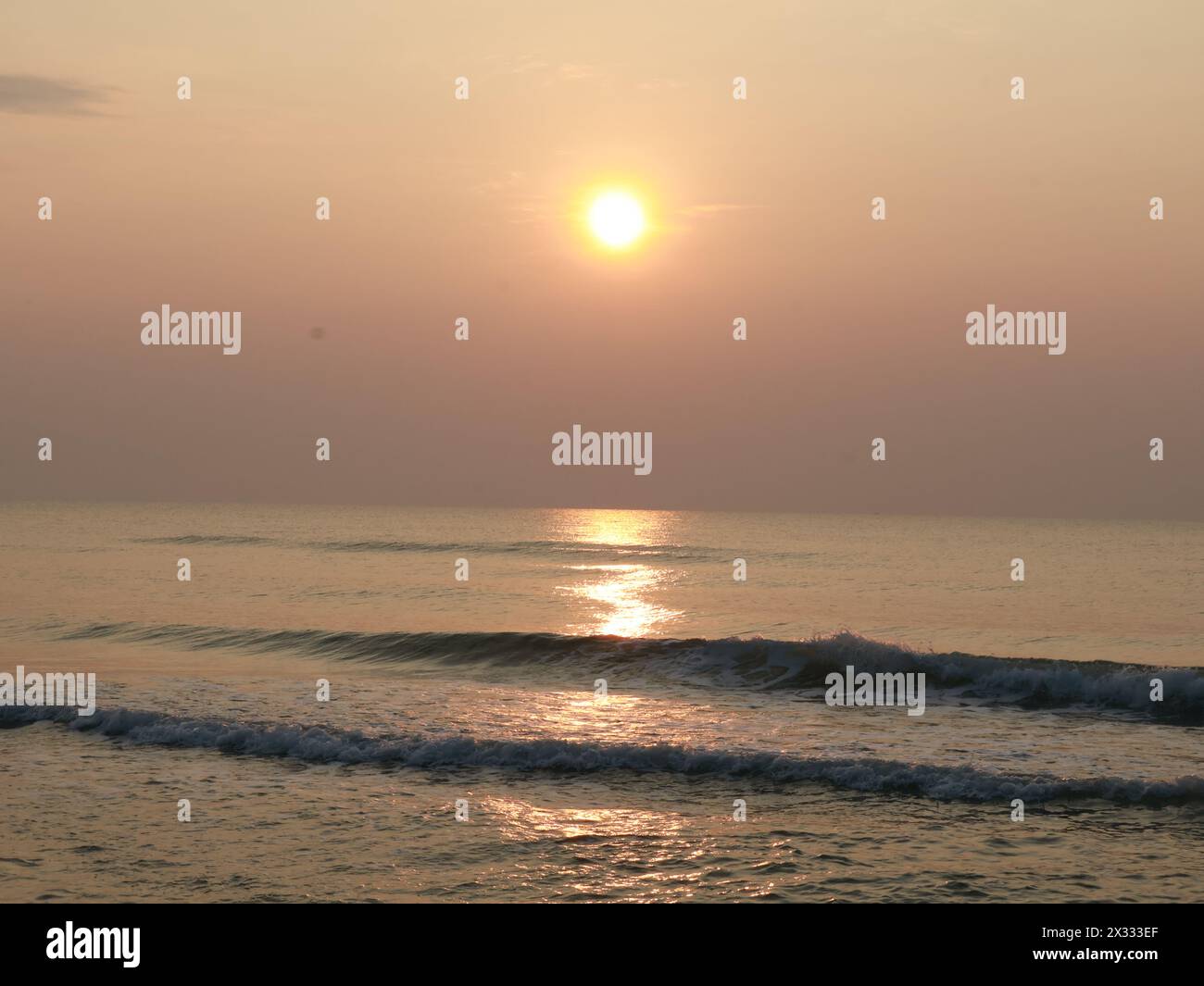 Sun rise over the peaceful sea in the early morning, Hua Hin, Thailand Stock Photo