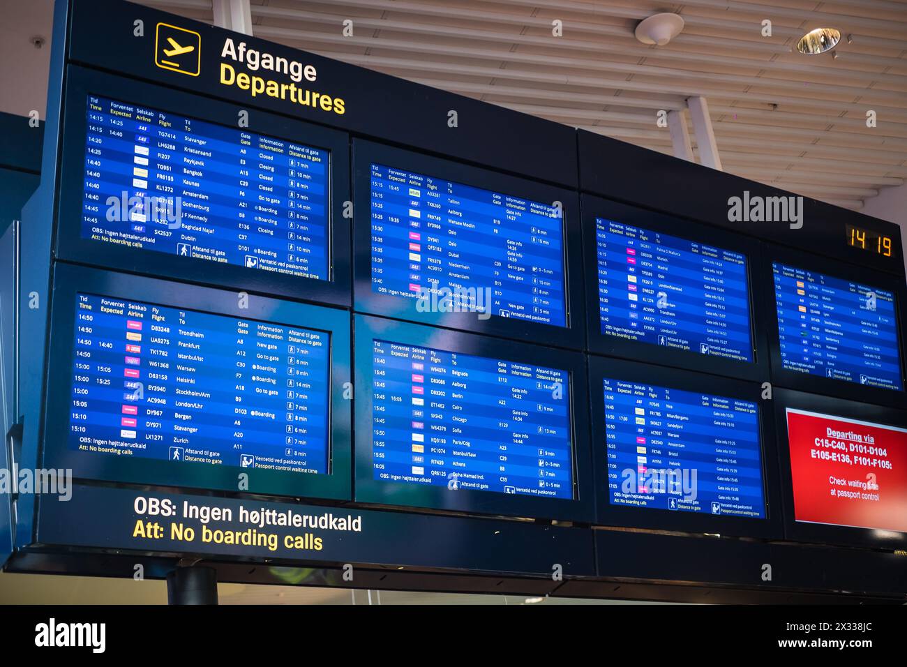 Copenhagen, Denmark - April 7, 2024: Flight boarding information screens at Copenhagen airport. Stock Photo