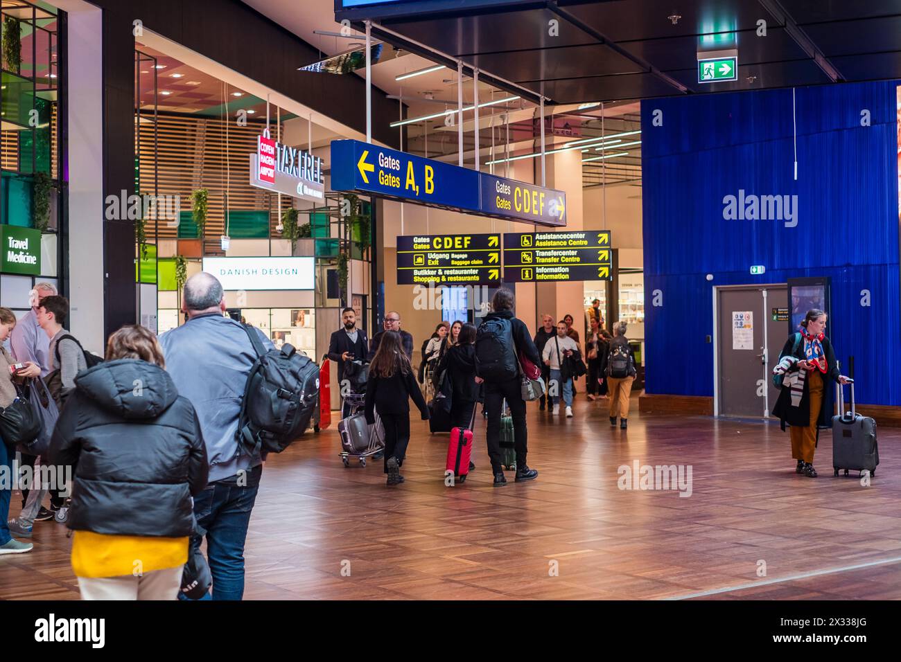 Copenhagen, Denmark - April 7, 2024: People walking inside Copenhagen airport terminal. Stock Photo