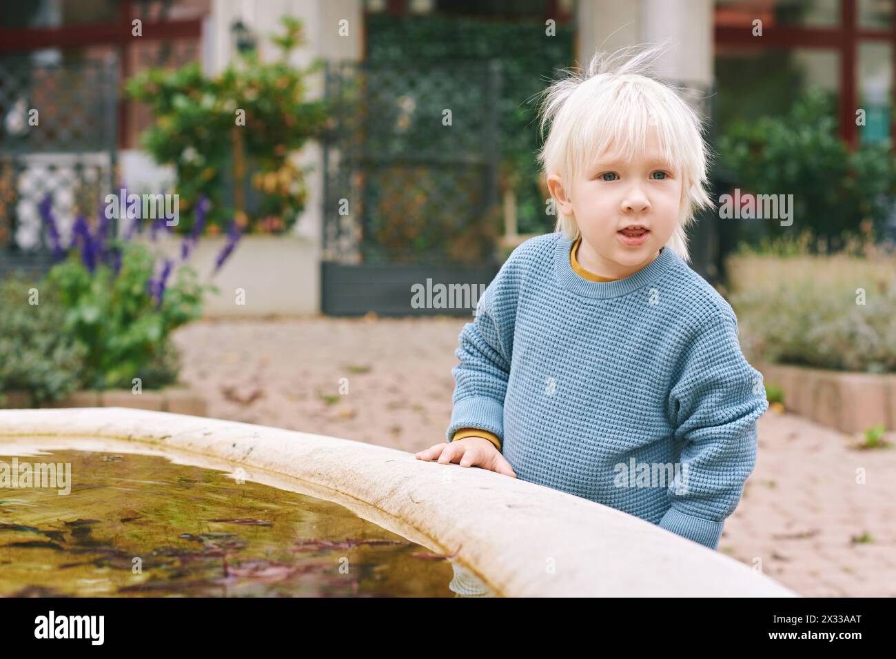 Outdoor portrait of adorable little boy playing outside Stock Photo