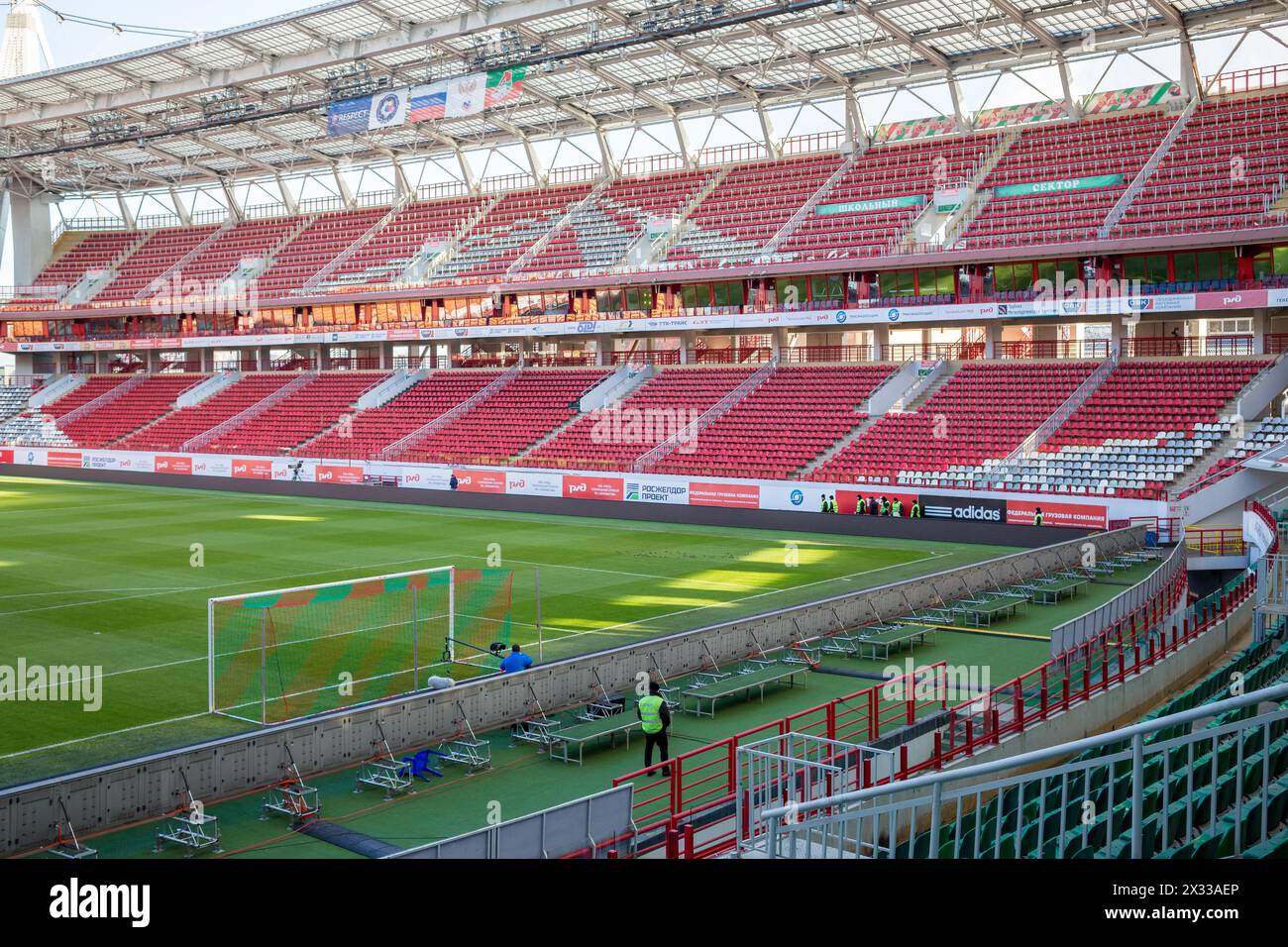RUSSIA, MOSCOW - NOV 02, 2014: Empty chairs on Locomotive soccer arena with few guards at autumn day. Aerial view Stock Photo