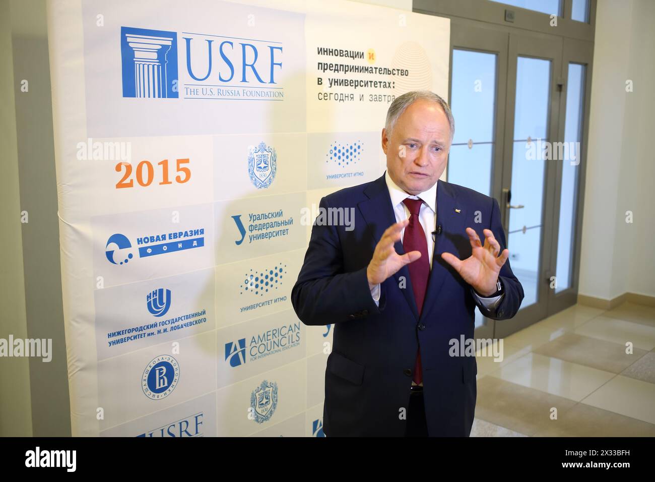 RUSSIA, MOSCOW - 18 MAY, 2015: Man is giving interview at conference the U.S. Russia Foundation in MSTU of N.E. Bauman. Stock Photo