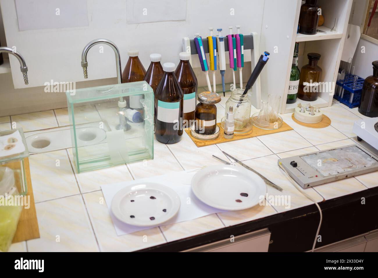 Chemical laboratory with preparations and burners for warming. Stock Photo
