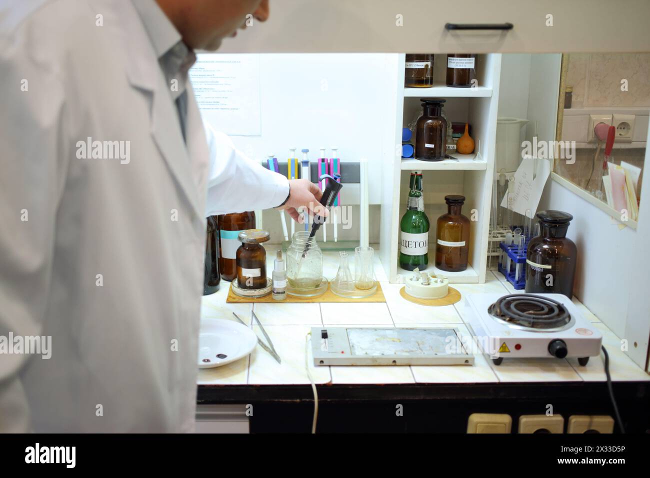 Chemical Robe Hands of man in white robe working in chemical laboratory Stock Photo ...
