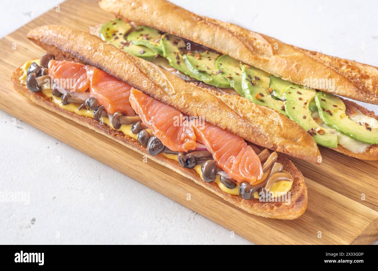 Salmon mushroom and avocado mozzarella baguette sandwiches Stock Photo